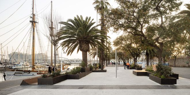 A pavilion area that is lined next to a water bank