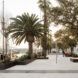 A pavilion area that is lined next to a water bank