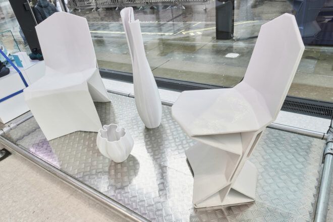 A chair, vase and bowl made out of recycled plastics created by a robot