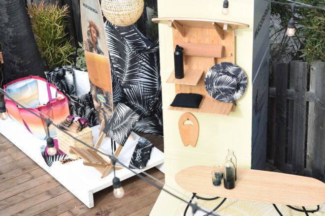 A collection from IKEA including tote bag, water bottle, hat, glass ware and surfboards