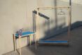 A clothes hanger with a blue table