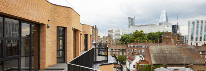 An outdoor terrace that overlooks a city landscape