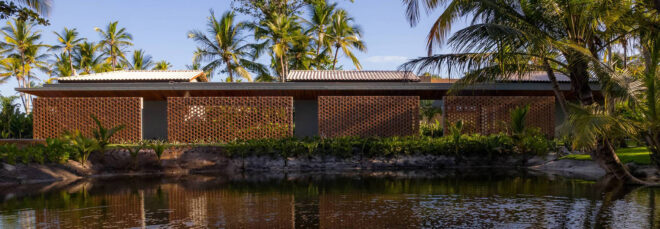 The side of the wooden structure resides a body of water