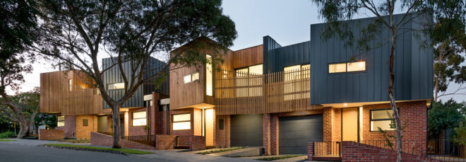 A house sits in an urban setting