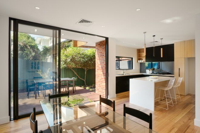 A kitchen area with floor-to-ceiling window
