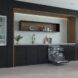 An open dishwasher in a kitchen space