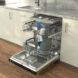 An open dishwasher displaying the bowls and plates set inside it