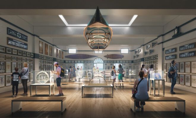 An interior museum space filled with framed items on the walls