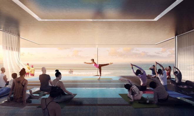 A yoga instructor demonstrating in front of a class