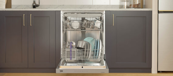 The front of an opened dishwasher featuring the plates and bowls within