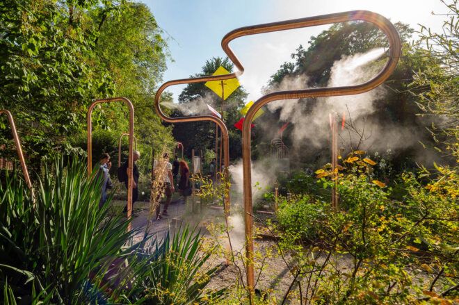 Mist coming out of copper pipes in a garden
