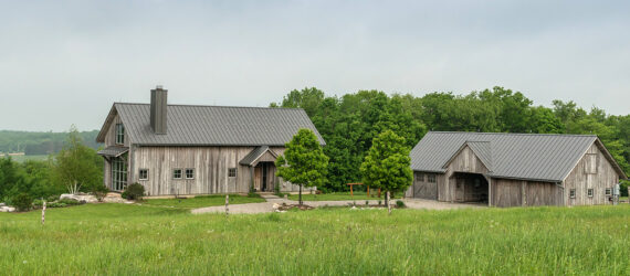 Two farmhouses within a prairie landscape