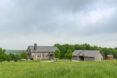 Two farmhouses within a prairie landscape