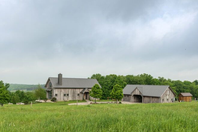 Two farmhouses within a prairie landscape