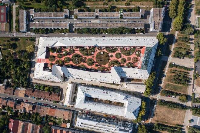 An aerial view shot downward on the floor plans features a inner tree pavilion