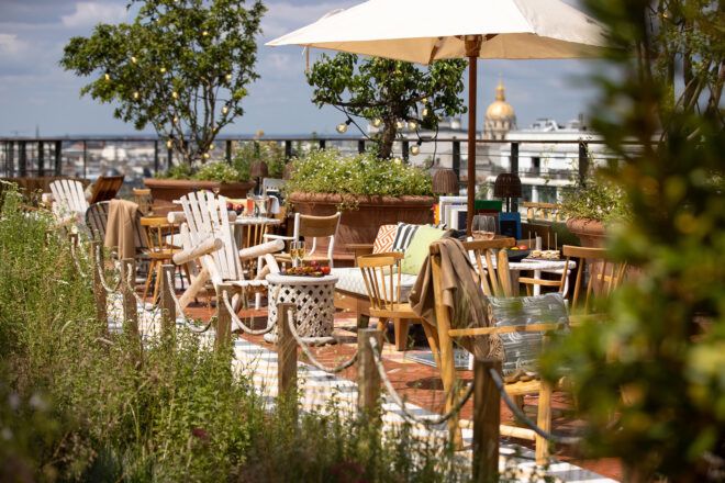 An outdoor seating area surrounded by greenery