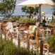 An outdoor seating area surrounded by greenery