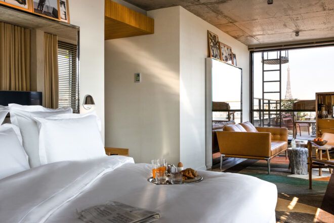 A bedroom connected to a seating area