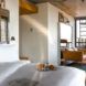 A bedroom connected to a seating area