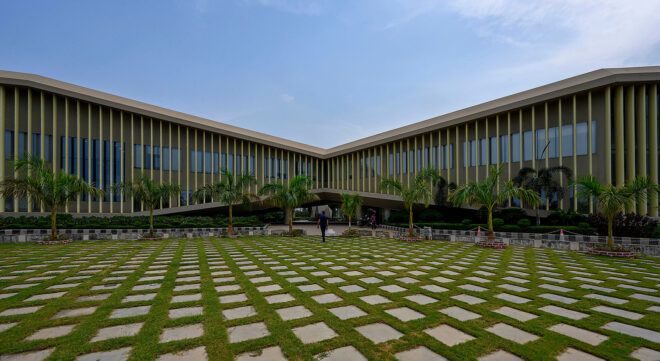 An open courtyard filled with stones and grass in between them