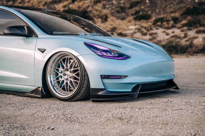 The front of a blue Tesla car