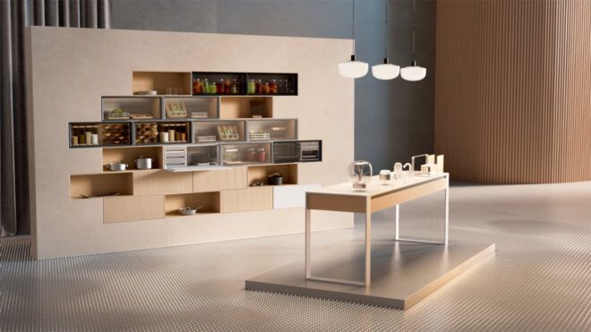 A showroom area with a wall of food. In front of it is a table with light hanging above it