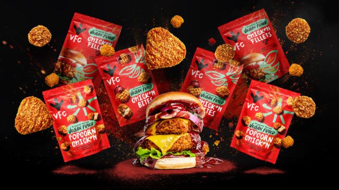 A vegan chicken sandwich surrounded by packets of the VFC packaging