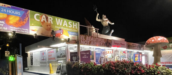 A plant-based convenience market lit up at night