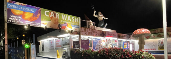 A plant-based convenience market lit up at night