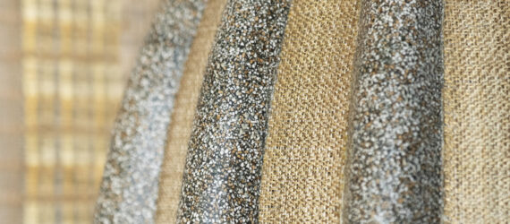 An up-close image of fabric that is silver and gold