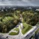 Aerial view of a park with lots of trees and greenery in a city