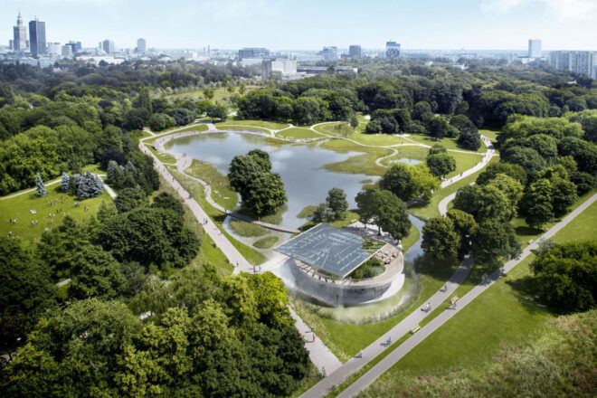 Aerial view of a large pond in a park, surrounded by several walkways and greenery