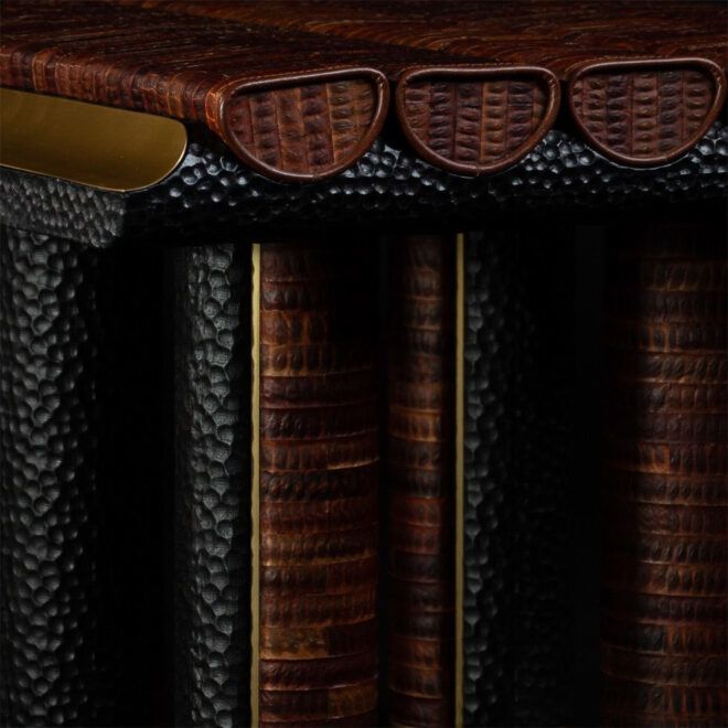 Close up of the seed-studded Leukeather and dimpled oak textures of an ottoman