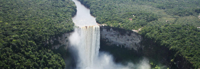 A Kaieteur Falls surrounded by a forested area