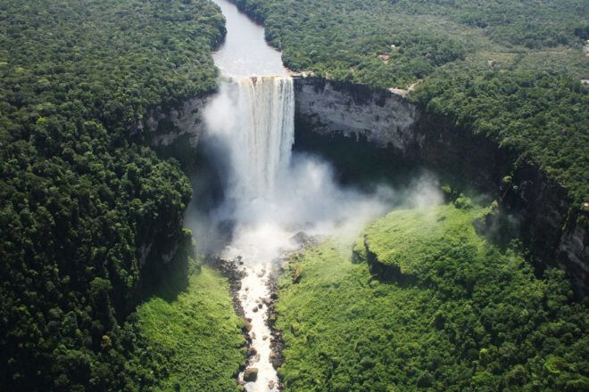 A Kaieteur Falls surrounded by a forested area