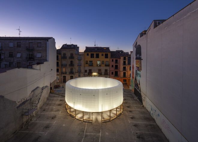 An inflatable ring glowing in the midst of a pavilion