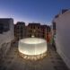 An inflatable ring glowing in the midst of a pavilion