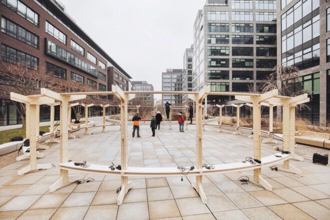 A wooden structure set on a cement outdoor area