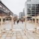 A wooden structure set on a cement outdoor area