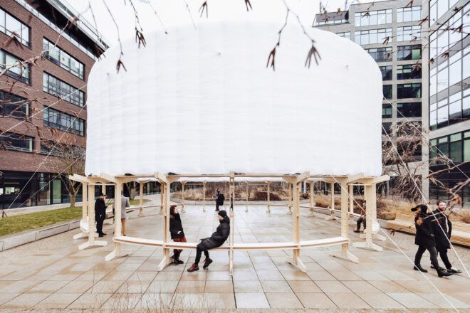 A white inflatable sits on top of a wooden structure