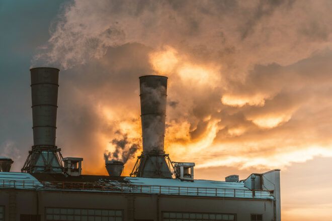 A fossil fuel farm spewing smoke
