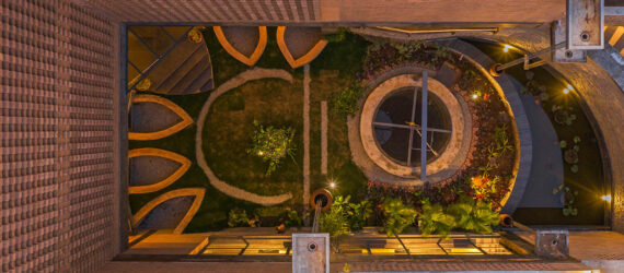 Shot from above below the view of a central pavilion and garden area