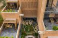 The different levels and sections of the eco-hotel have greenery on them