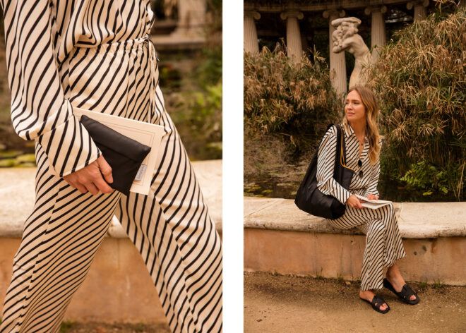 A woman holding the tote folded into a rectangle and the woman wearing it unfolded on her shoulder