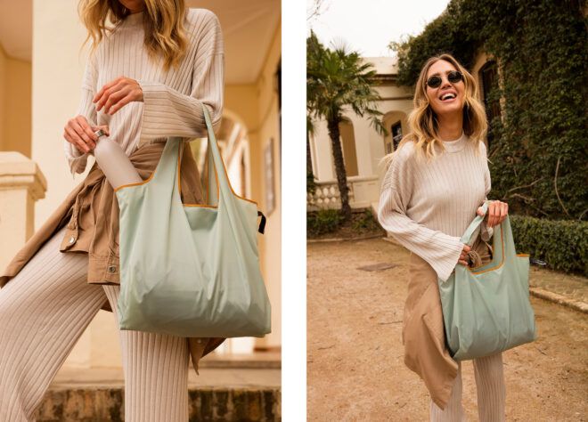 A woman holding a green, mint tote bag