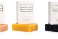 Three soap bars from Rustic Element in colors left to right: pink, yellow and black