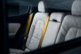 Leather gray back seating with gold seatbelt straps