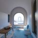Inside one of the residencies with a large arch window