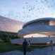 Evening rendering of the museum showing people walking to the entrance and on the spiral ramp