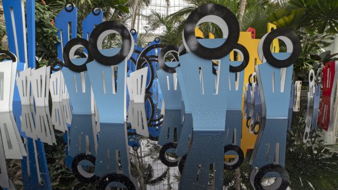 Up-close of the blue cutouts look like silhouettes of people